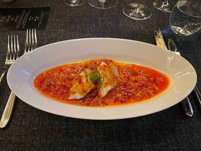 Steamed yellow croaker prepared with a fermented Doubanjiang sauce made with lychee (Hong Yoo/The Korea Herald)