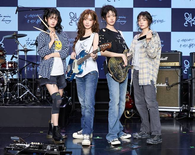 From left: QWER's Chodan, Magenta, Hina and Siyeon pose for a photo at a press conference in Mapo-gu, western Seoul, Monday. (Content X)