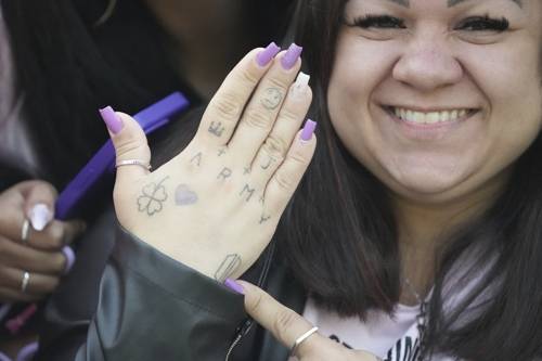 South Korea Music BTS Jimin Jung Kook Daiane Matos from Brazil, 37, shows her hand as she waits for arrival of K-pop band BTS members Jimin and Jung Kook in Yeoncheon, South Korea, Wednesday, June 11, 2025. (AP Photo/Lee Jin-man)  <Copyright (c) Yonhap News Agency prohibits its content from being redistributed or reprinted without consent, and forbids the content from being learned and used by artificial intelligence systems.>
