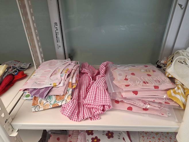 Clothes donated for the babies are neatly arranged at Babybox Korea. (Shin Ji-hye/The Korea Herald)