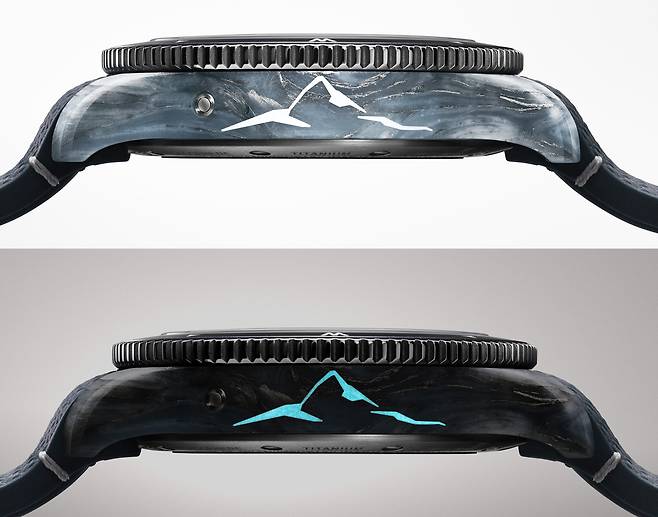 빙하의 복잡한 결정 구조를 연상시키는 합성 신소재 케이스가 특징이다. 어두운 곳에서 빈슨산의 실루엣이 보인다. 사진 몽블랑