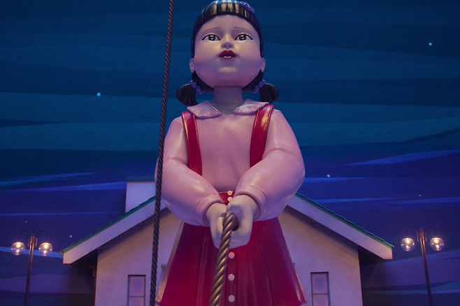 Killer doll Young-hee seen holding a giant jumping rope in "Squid Game" 3 (Netflix)