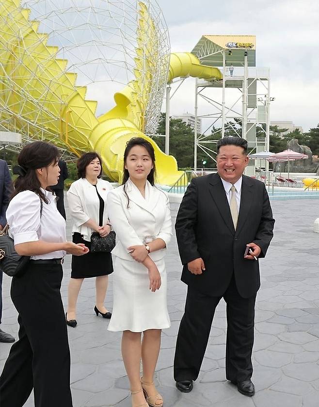 North Korean leader Kim Jong-un (from right), his daughter Ju-ae, and wife Ri Sol-ju attend a completion ceremony for the Wonsan-Kalma Coastal Tourist Zone on June 24. Behind them is Foreign Minister Choe Son-hui. /Rodong Sinmun