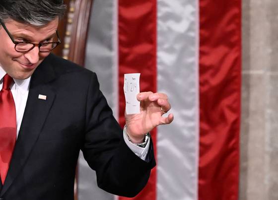 U.S. House Speaker Mike Johnson shows the final tally of the vote on U.S. President Donald Trump's tax bill on the floor of the House of Representatives at the U.S. Capitol in Washington on July 3. Congress passed the One Big Beautiful Bill Act, despite misgivings in his party over concerns that the national debt will balloon and the historic assault on the social safety net. [AFP/YONHAP]