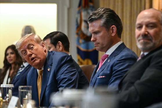 U.S. President Donald Trump speaks alongside Defense Secretary Pete Hegseth and Commerce Secretary Howard Lutnick during a cabinet meeting in the Cabinet Room of the White House in Washington on July 8. [AFP/YONHAP]