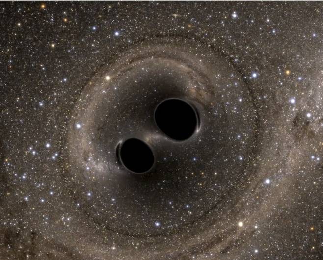 2016년 LIGO가 처음으로 감지한 두 블랙홀 충돌 사건 이후 방출된 두 블랙홀의 컴퓨터 시뮬레이션. LIGO 연구소/Reuters 제공.