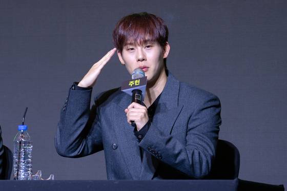 Monsta X's Joojoney salutes during a press conference in western Seoul on July 16, ahead of its 10th anniversary concert. [DANIELA GONZALEZ PEREZ]