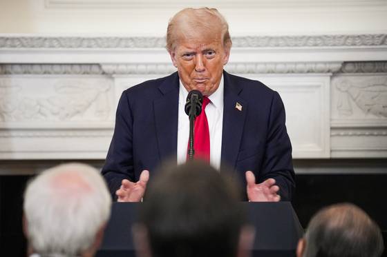 U.S. President Donald Trump participates in the White House Faith Office Luncheon in the State Dining Room at the White House in Washington on July 14. [EPA/YONHAP]