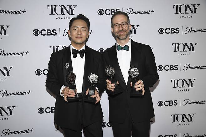 Hue Park, left, and Will Aronson pose in the press room with the awards for best original score and best book of a musical for "Maybe Happy Ending" during the 78th Tony Awards on Sunday, at Radio City Music Hall in New York. (AP-Yonhap)
