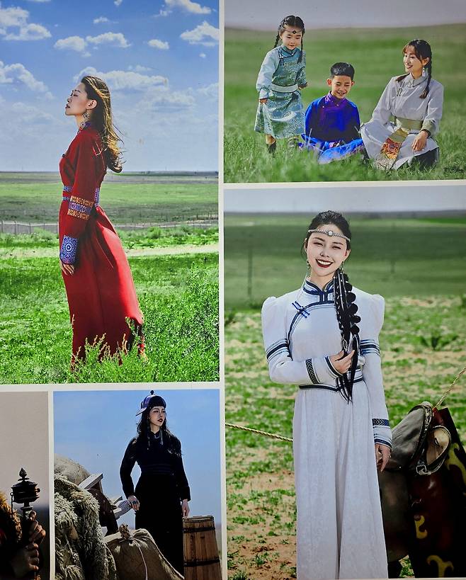 몽골 사람들이 세련된 모습으로 초원을 배경으로 사진 찍은 모습
