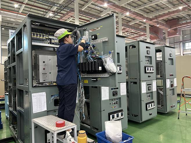A worker produces switchgears at LS Electric's manufacturing plant in Bac Ninh, the outskirts of Hanoi, Vietnam. [SARAH CHEA]