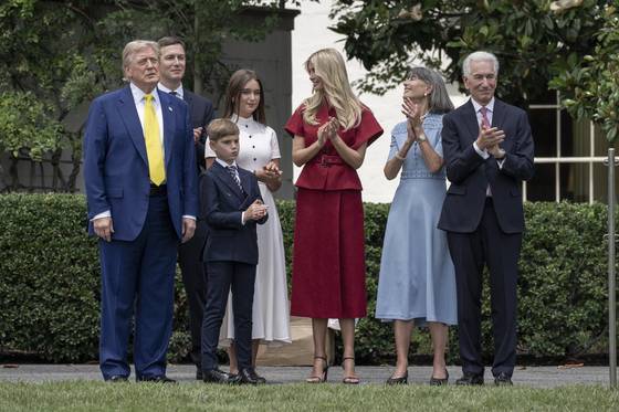 U.S. President Donald Trump, alongside newly sworn-in Ambassador to France Charles Kushner, Ivanka Trump and her husband Jared Kushner, looks on as a U.S. flag is raised on a newly installed flag pole on the South Lawn at the White House in Washington, on June 18. [EPA/YONHAP]