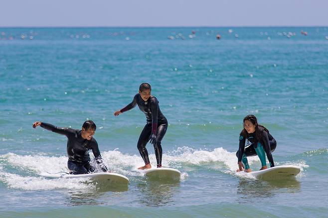 Surfers at Songjeong Beach in Busan (Thanks Poseidon)