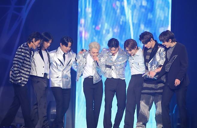 Boy band Ateez form a group hug during the Seoul concert for its world tour ″Towards the Light: Will to Power″ held at Jamsil Stadium in Songpa District, southern Seoul on Jan 28, 2024. [KQ ENTERTAINMENT]