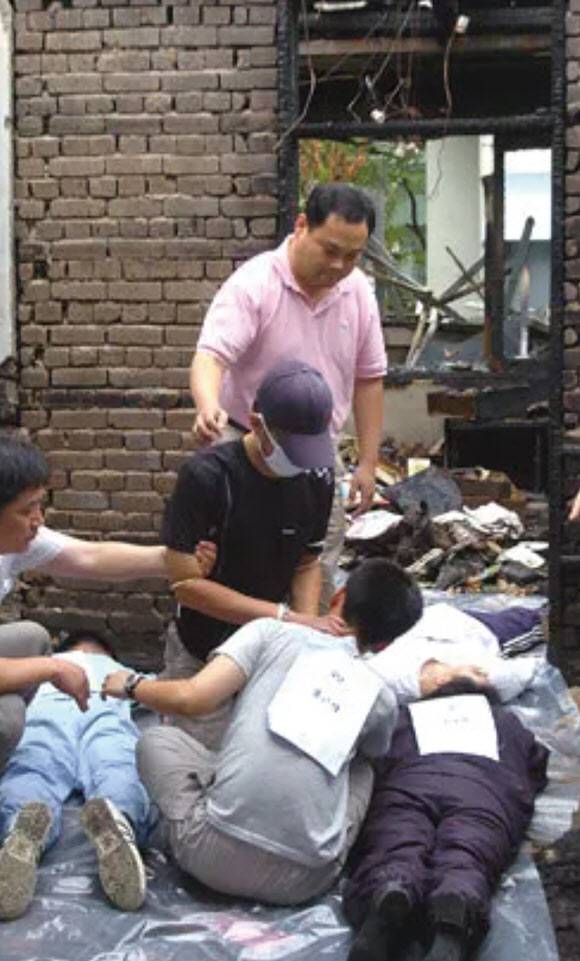 현장 검증을 하는 장기수(모자 쓴 사람). (사진=연합뉴스)