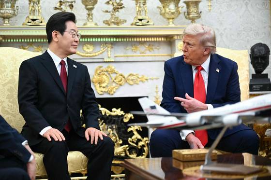 U.S. President Donald Trump, right, speaks during a bilateral meeting with Korean President Lee Jae Myung in the Oval Office of the White House in Washington on Aug. 25. [AFP/YONHAP]
