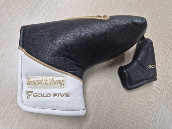 A custom-made Korean putter by Gold Five, engraved with the title “45th and 47th President of the United States” and the name of Donald Trump [JOINT PRESS CORPS]