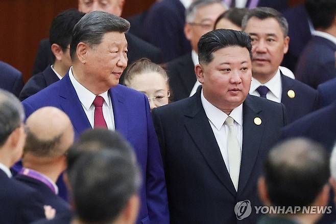 시진핑 중국 국가주석(좌)과 김정은 북한 국무위원장(우) [타스 연합뉴스 자료사진. 재판매 및 DB 금지]