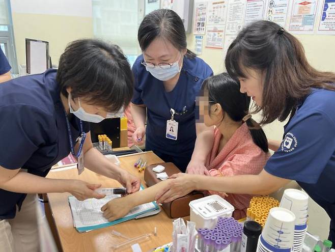 Medical staff at Seoul Medical Center conduct health screenings for people with disabilities on September 4. / Courtesy of the Purme Foundation