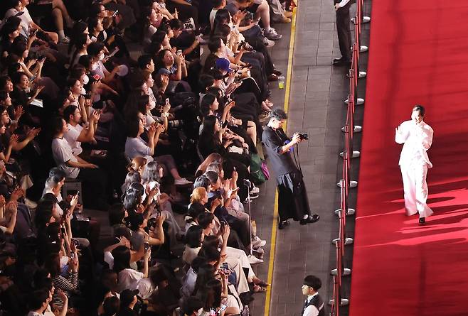 Maggie Kang walks down the red carpet on the opening night of Busan International Film Festival on Sept. 17 [YONHAP]