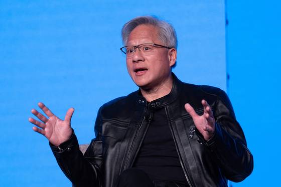 CEO of Nvidia Jensen Huang speaks as he takes part in a panel discussion with Britain's Prime Minister Keir Starmer during the London Tech Week, in London, on June 9. [AFP/YONHAP]