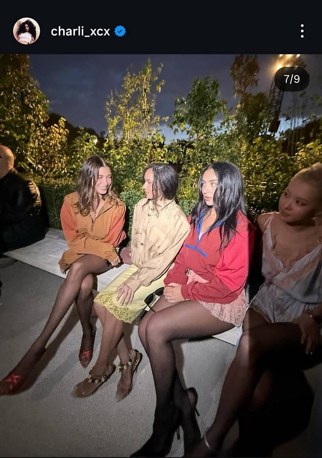 A picture shows a less visible Rose (right), posted by Charli XCX. (Charli XCX's Instagram)