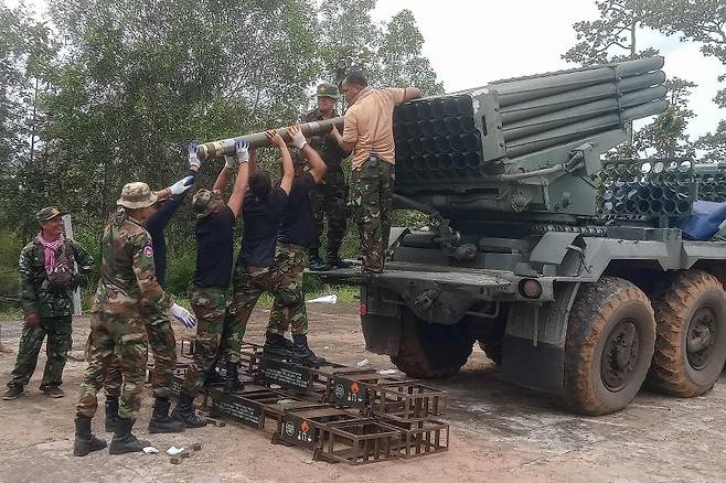 Cambodian soldiers loading a BM-21 rocket launcher.