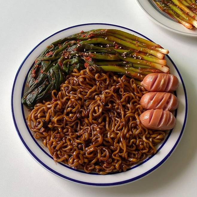 Chapagetti served with pa-kimchi, or green onion kimchi [SCREEN CAPTURE]