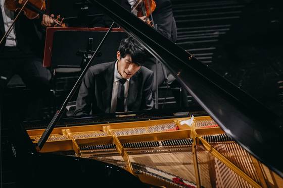 Pianist Eric Lu performs during the final stage of the 19th International Fryderyk Chopin Piano Competition at Warsaw Philharmonic Hall, Poland, on Oct. 21. [CHOPIN INSTITUTE]