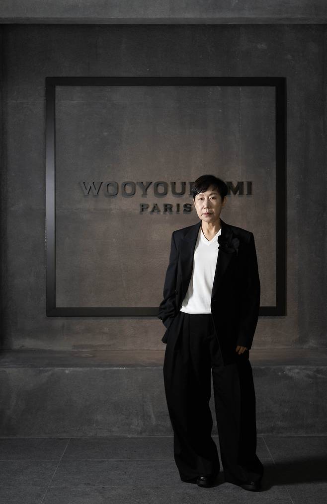 Designer Woo Young-mi poses for a photo at Wooyoungmi Itaewon, the brand's first flagship store in Seoul, ahead of an interview with The Korea Herald on Thursday. (Lee Sang-sup/The Korea Herald)