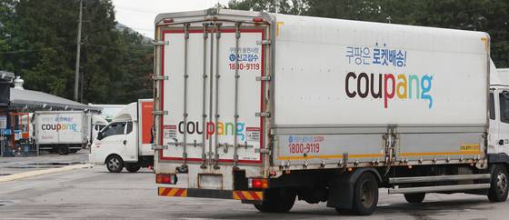 The Coupang logo is seen on a delivery truck at the company's logistics center in Seoul on Aug. 6. [YONHAP]
