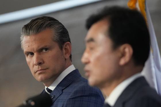 U.S. Defense Secretary Pete Hegseth, left, looks at Korean Defense Minister Ahn Gyu-back while he speaks during a joint press conference following the 57th Security Consultative Meeting at the Defense Ministry in central Seoul on Nov. 4. [AP/YONHAP]