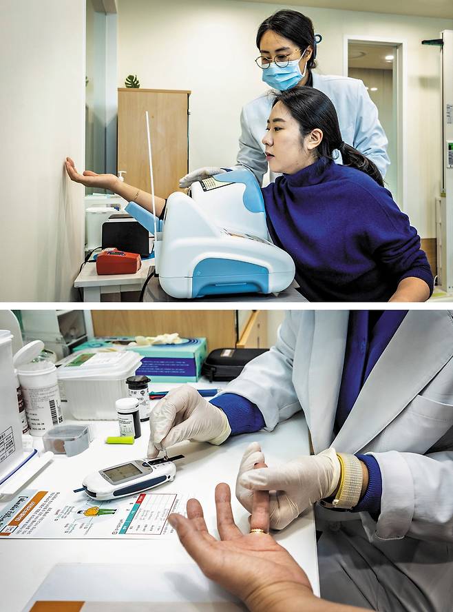 본지 남정미 기자가 간호사의 안내에 따라 혈압 측정과 피 검사를 받는 모습. /이신영 영상미디어 기자