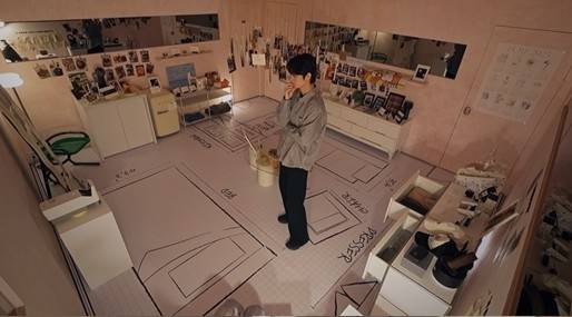 A still shows Woo-jin looking through old photos from his past relationship with Ji-yeon in the show’s "ex room." [TVING]