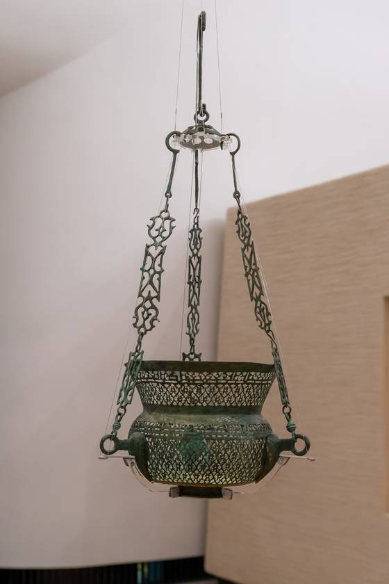 An Abbasid lamp displayed inside the Through Our Connections gallery at the Zayed National Museum [ZAYED NATIONAL MUSEUM]