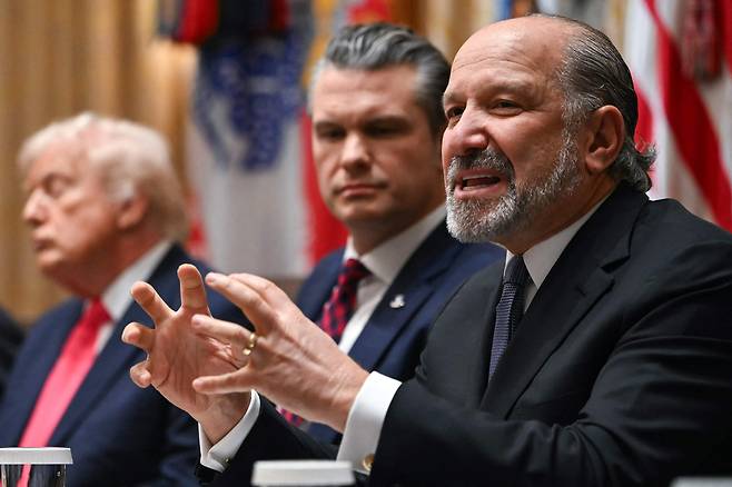 U.S. Secretary of Commerce Howard Lutnick, far right, speaks alongside U.S. Secretary of Defense Pete Hegseth, center, and U.S. President Donald Trump, left, during a cabinet meeting in the Cabinet Room of the White House in Washington on Dec. 2. [AFP/YONHAP]
