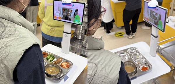 명현학교에서 한 학생이 푸드 스캐너로 식판을 찍고 있다./사진=이슬비 기자