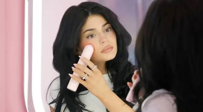 Influencer and model Kylie Jenner, the youngest of the Kardashian-Jenner clan, is seen using an APR beauty device in a promotional video uploaded to her YouTube channel, ″Kylie News Daily″ [APR]