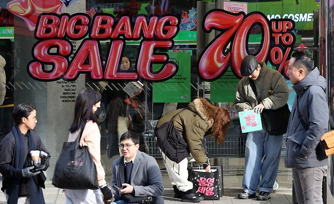 Tourists and shoppers are seen in front of Olive Young's Myeondong store in Jung District, central Seoul, on Dec. 1, 2024. [NEWS1]