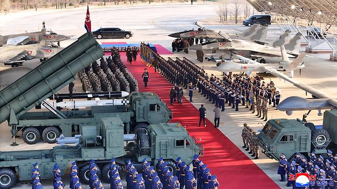 North Korean leader Kim Jong-un and his daughter Ju-ae attend the 80th anniversary of the establishment of the Air Force of the Korean People's Army at the Kalma Airport of the 59th Kil Yong Jo Hero Regiment of the 2nd Air Division on Nov. 28. [KOREAN CENTRAL NEWS AGENCY]