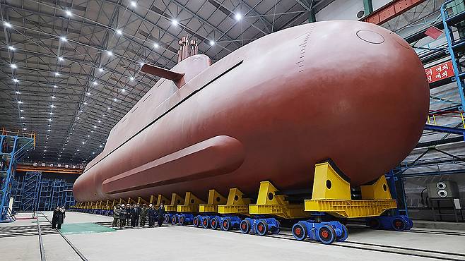 An 8,700-ton nuclear-powered strategic guided missile submarine is seen during an inspection by North Korean leader Kim Jong-un, not pictured, in this photo provided by the state-run Korean Central News Agency on Dec. 25. [KOREAN CENTRAL NEWS AGENCY]