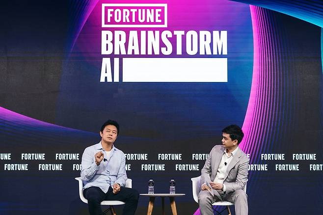 Kyogu Lee (left), Supertone founder and CEO, speaks at “Brainstorm AI Singapore: The Age of Intelligence” on July 23. (Hybe)