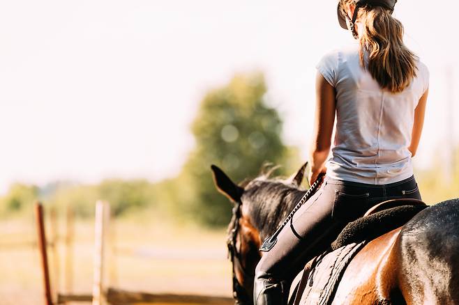 A woman riding a horse (Getty Images Bank)
