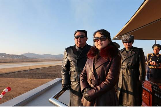 North Korean leader Kim Jong-un, left, and his daugher Kim Ju-ae, center, are seen during a visit to an air force unit in December 2023. [RODONG SINMUN]
