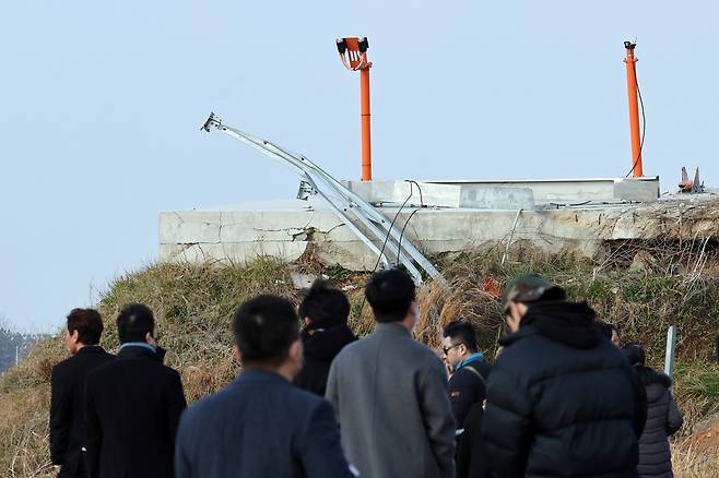 Bereaved family members visit the collision site at Muan International Airport in South Jeolla Province on Dec. 29, 2025, marking the first anniversary of the Jeju Air crash. (Yonhap)