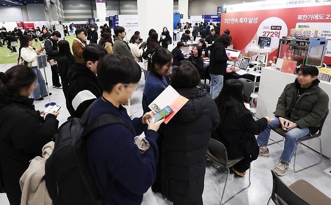 Job seekers wait for recruitment consultations at the 2026 Startup Job Fair at Coex in southern Seoul on Sunday. (Yonhap)