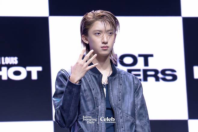 LNGSHOT’s Woojin poses for photos during a showcase for the release of the group’s first EP, ″Shot Callers,″ at Myunghwa Live Hall in western Seoul on Jan. 13. [DANIELA GONZALEZ PEREZ]