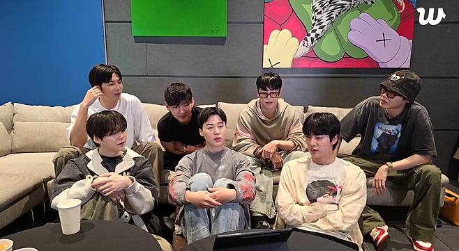 BTS members appear in live broadcast with fans on Weverse, Hybe's global fandom platform, July 2025. (Big Hit Music)
