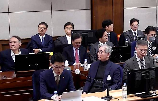 Defendants facing charges of leading an insurrection, including former President Yoon Suk Yeol, second row far left, and former Minister of National Defense Kim Yong-hyun, first row center, are seen during a hearing at Seoul Central District Court in Seocho District, southern Seoul, on Jan. 9. [SEOUL CENTRAL DISTRICT COURT]