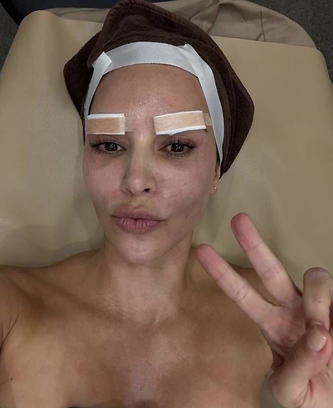 Kim Kardashian poses at a dermatologist clinic in Korea, where she received stem cell and skin booster treatments. (@kimkardashian, Instagram)